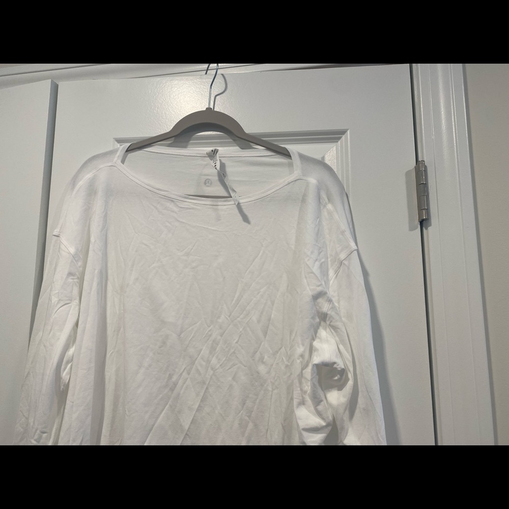 Lululemon white breathable shirt. Size XL. Never worn. Perfect condition.